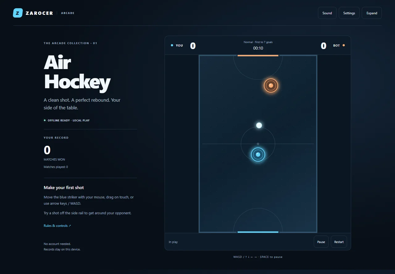 Air Hockey blue and orange strikers during a match